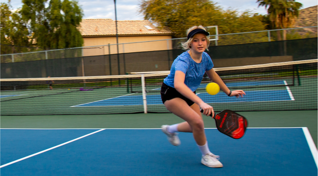 Girl playing pickleball with Helium Versus Paddle